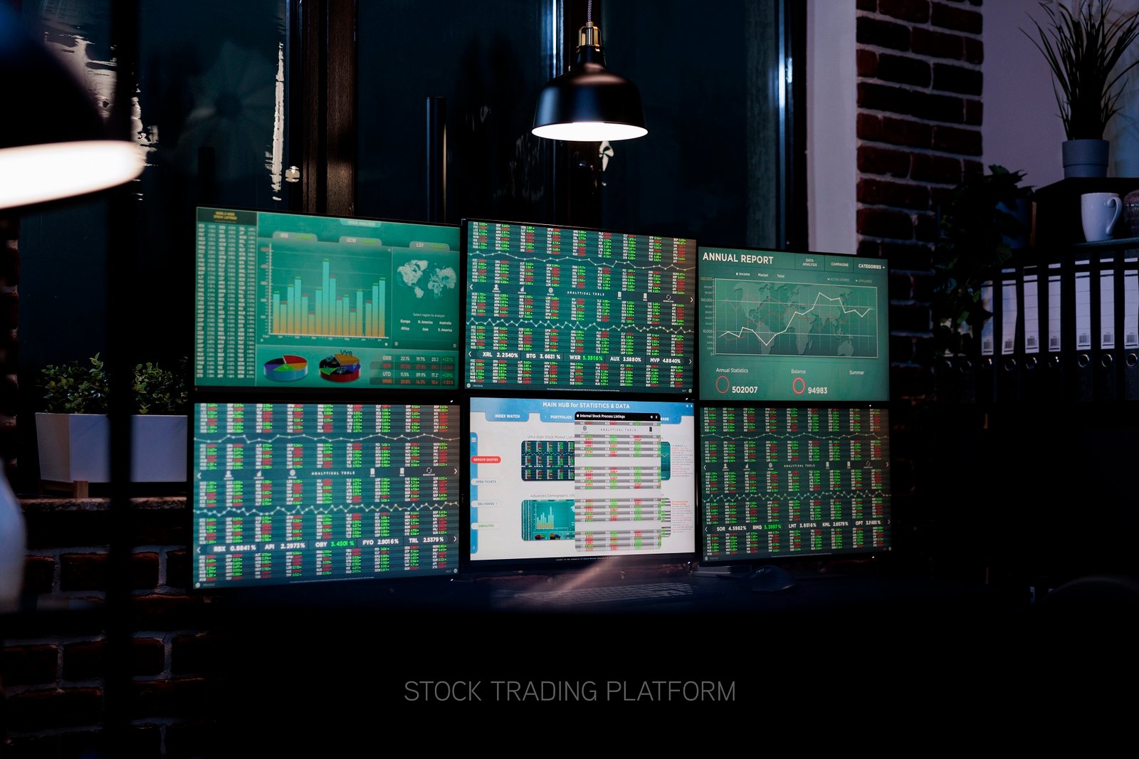 Empty interior of forex market exchange company office with financial data and growth charts on multiple displays. Workspace equipped with workstation having finance statistics and real time graph.