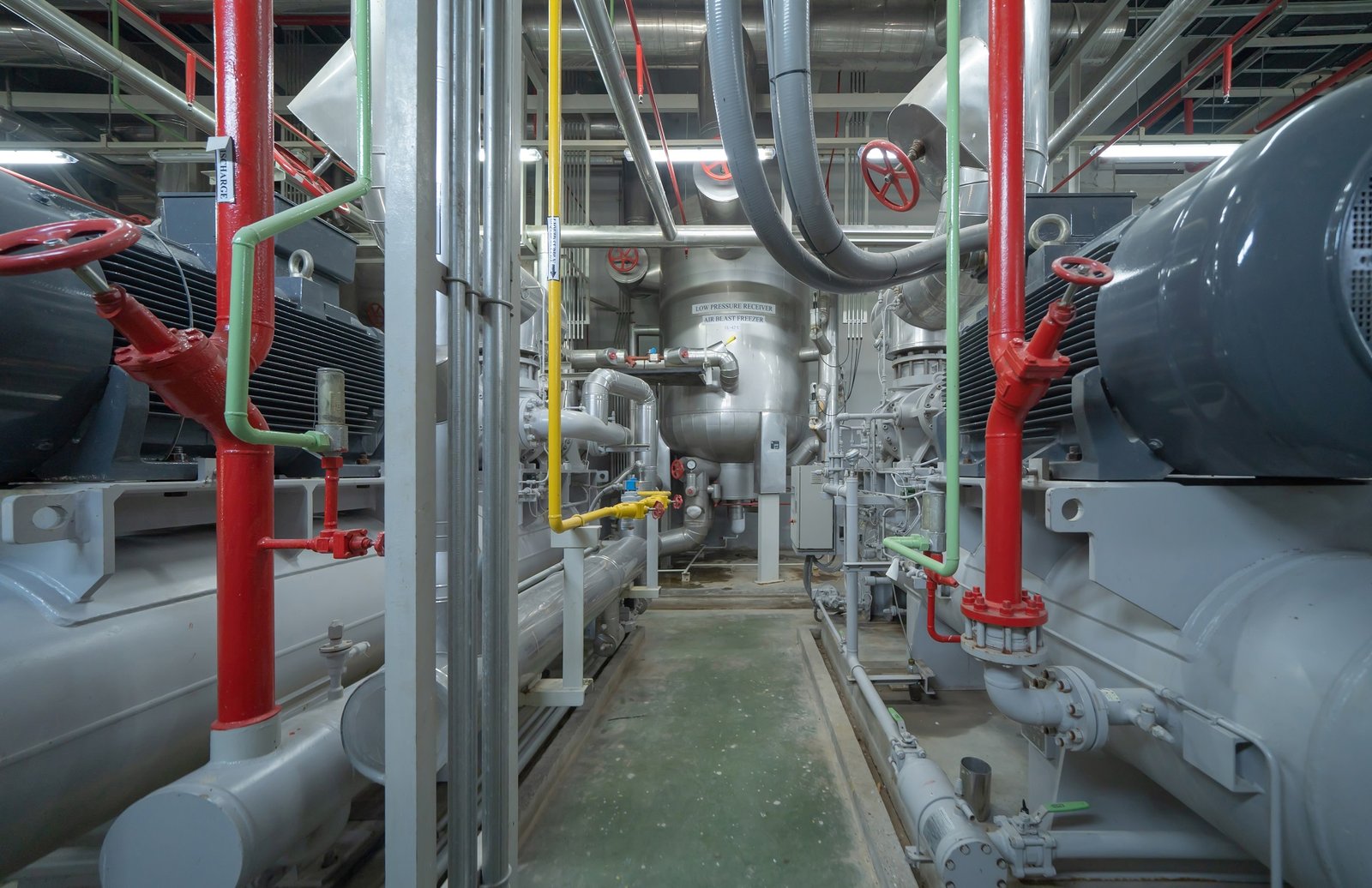 Inside of Industry factory. Chiller tower or cooling tower in building. System work machine. Condenser Water Supply and return pipe lines. Ventilation compressor. Water system in workshop.